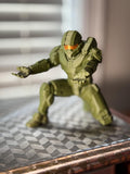 Master Chief 3D printed pen holder in olive green on a desk