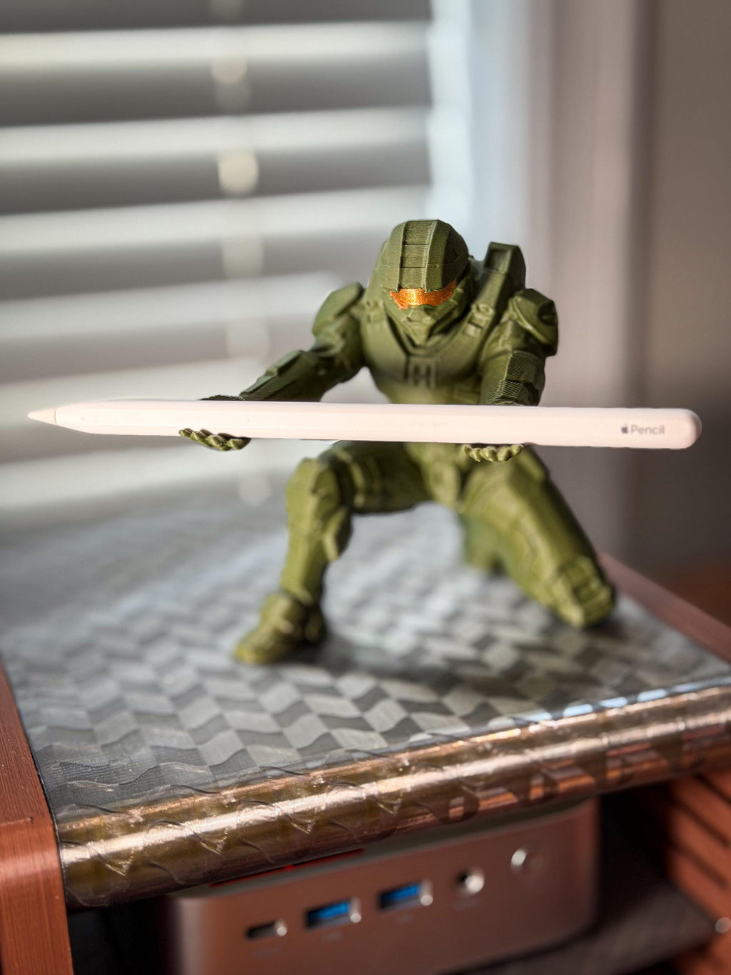 Halo-inspired Master Chief pen holder holding a pen